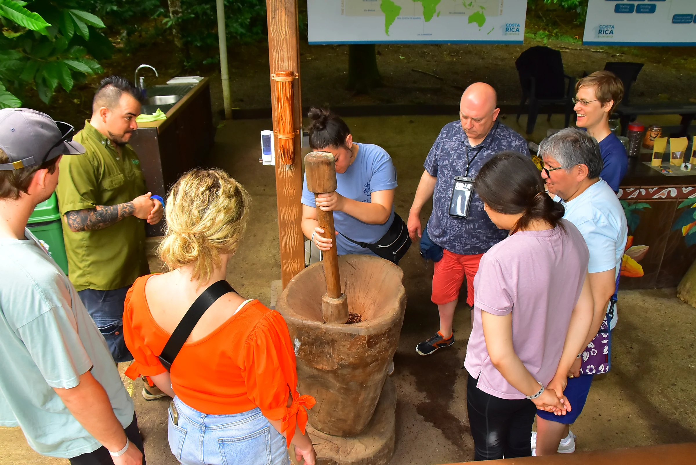 Guests learning to grind cacao