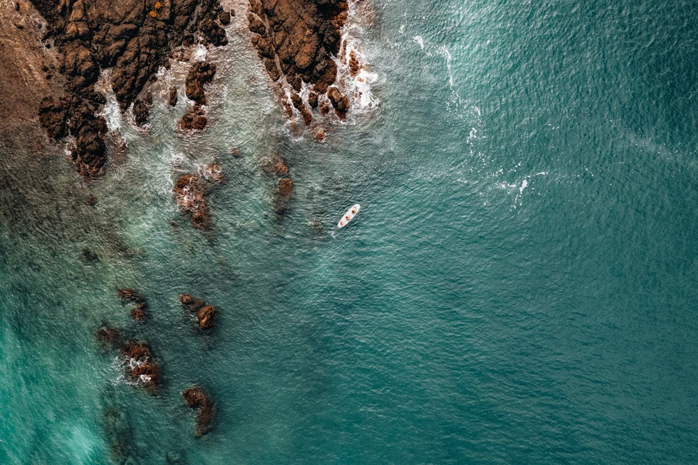 Turquoise water over coastal rocks