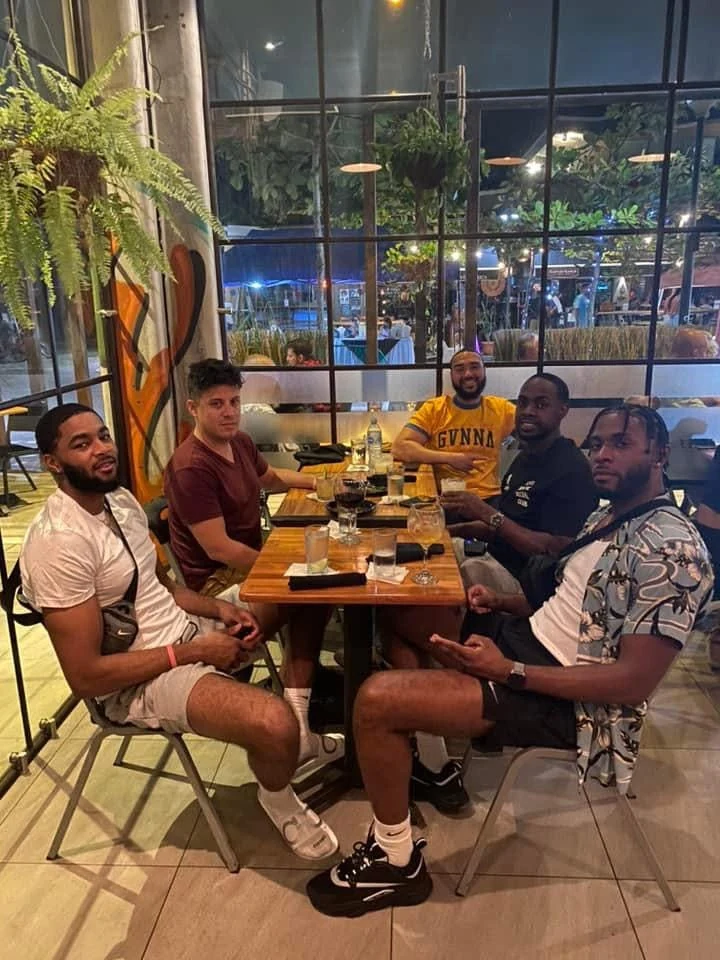 Friends gathered around a dinner table