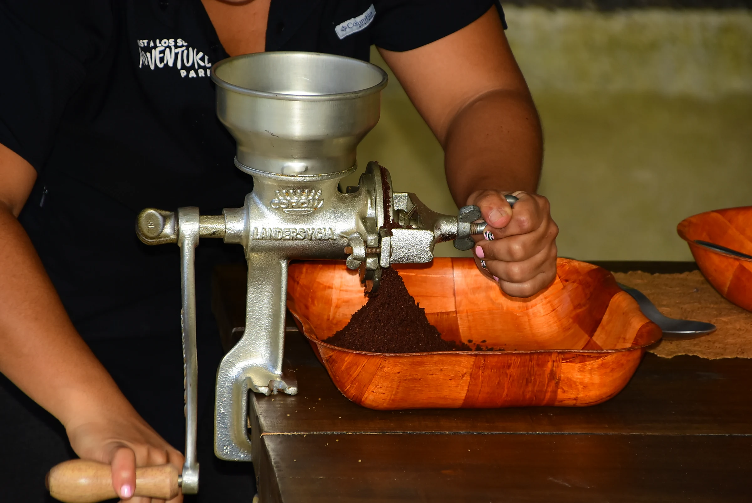 Grinding roasted cacao by hand